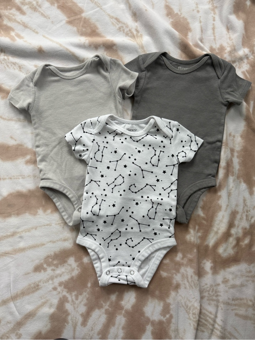 Hanes Baby One-Piece Bodysuits in White, Light Gray, and Dark Gray